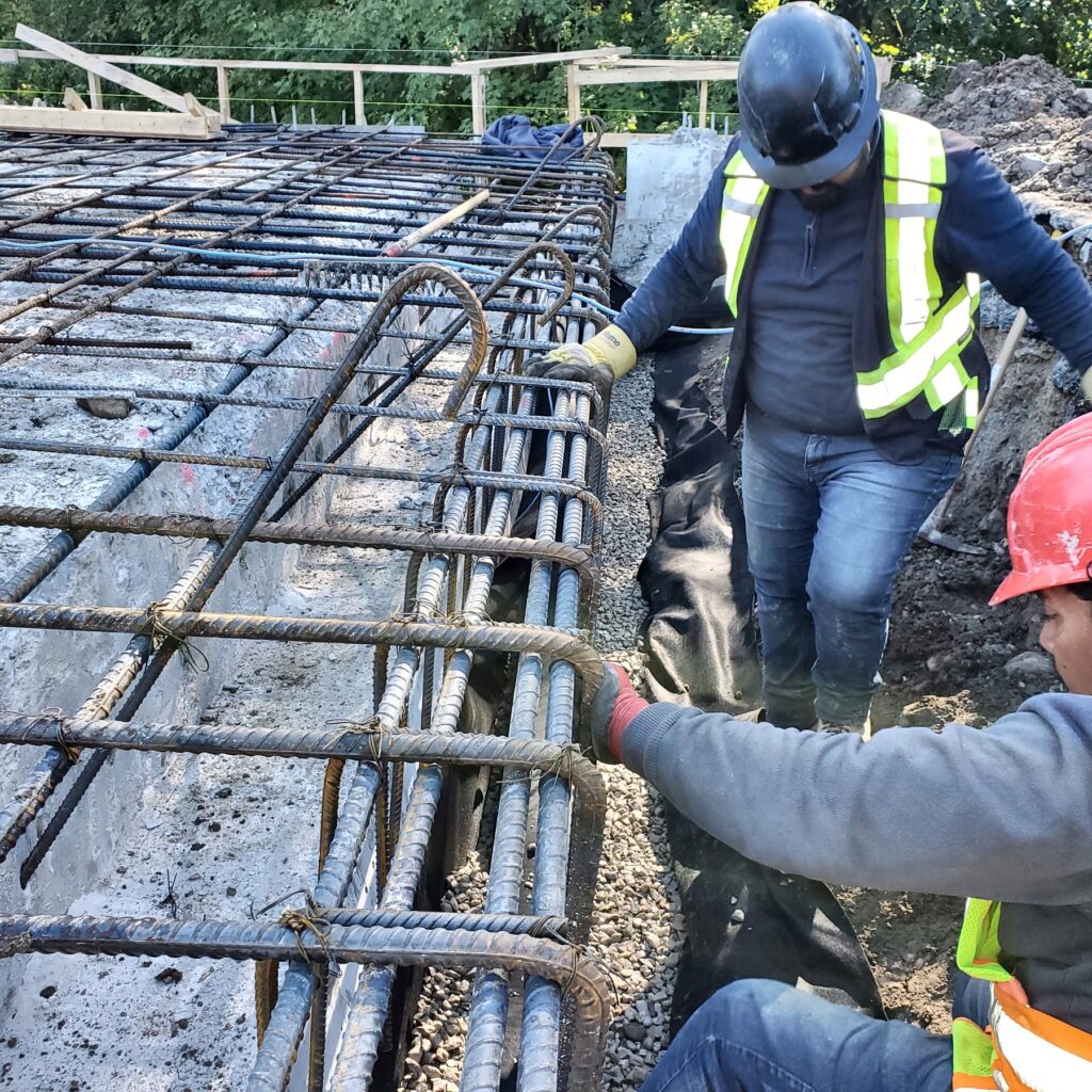 Crew tying rebar, concrete foundation work in Newmarket by Grand Structural Services