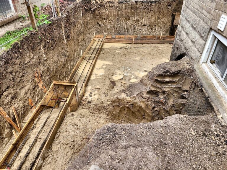 Footing trench beside house, Grand Structural Services, Toronto
