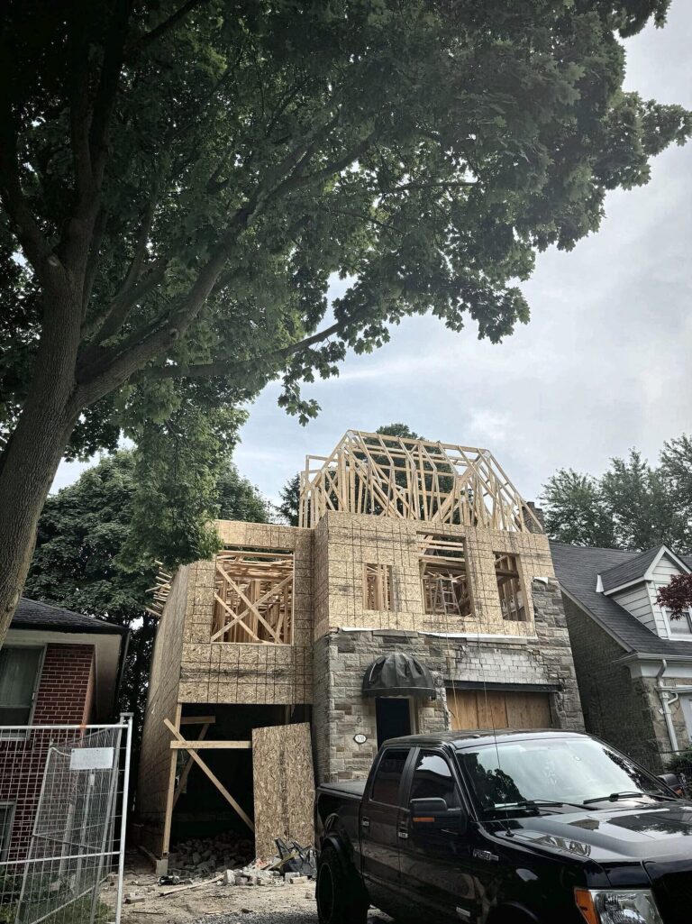 Framing new home roof trusses, concrete foundation contractor in Cornell, Markham by Grand Structural Services